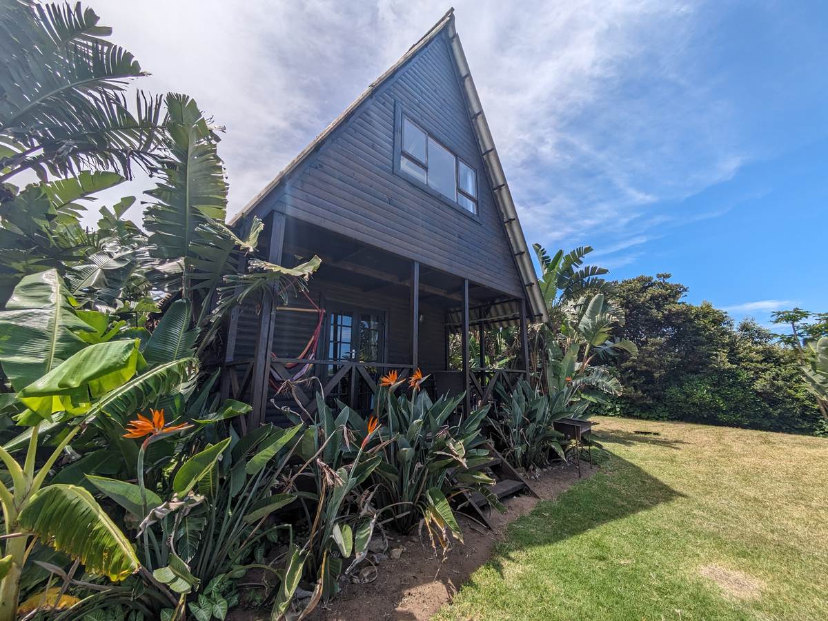 A-frame bungalow in the garden at Umzumbe Surf Camp