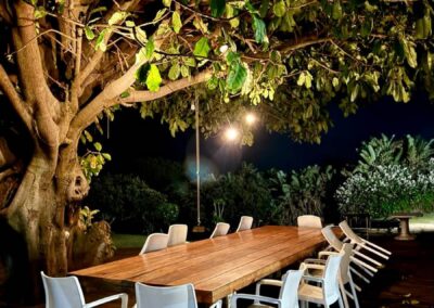 Dining deck under the tree at night, Umzumbe Surf Camp