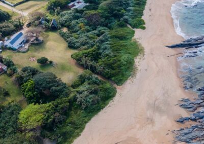 Aerial view of Umzumbe Surf Camp beside the beach
