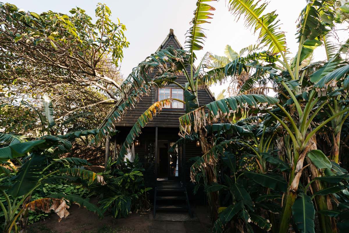 A-frame bungalow in the garden at Umzumbe Surf Camp