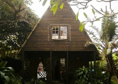 Exterior of an A-frame bungalow at Umzumbe Surf Camp