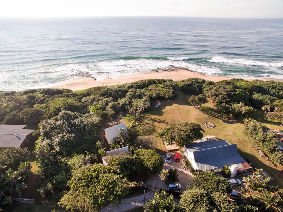 Aerial view of Umzumbe Surf Camp and the ocean