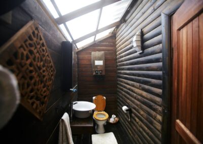 Wooden bathroom at Umzumbe Surf Camp