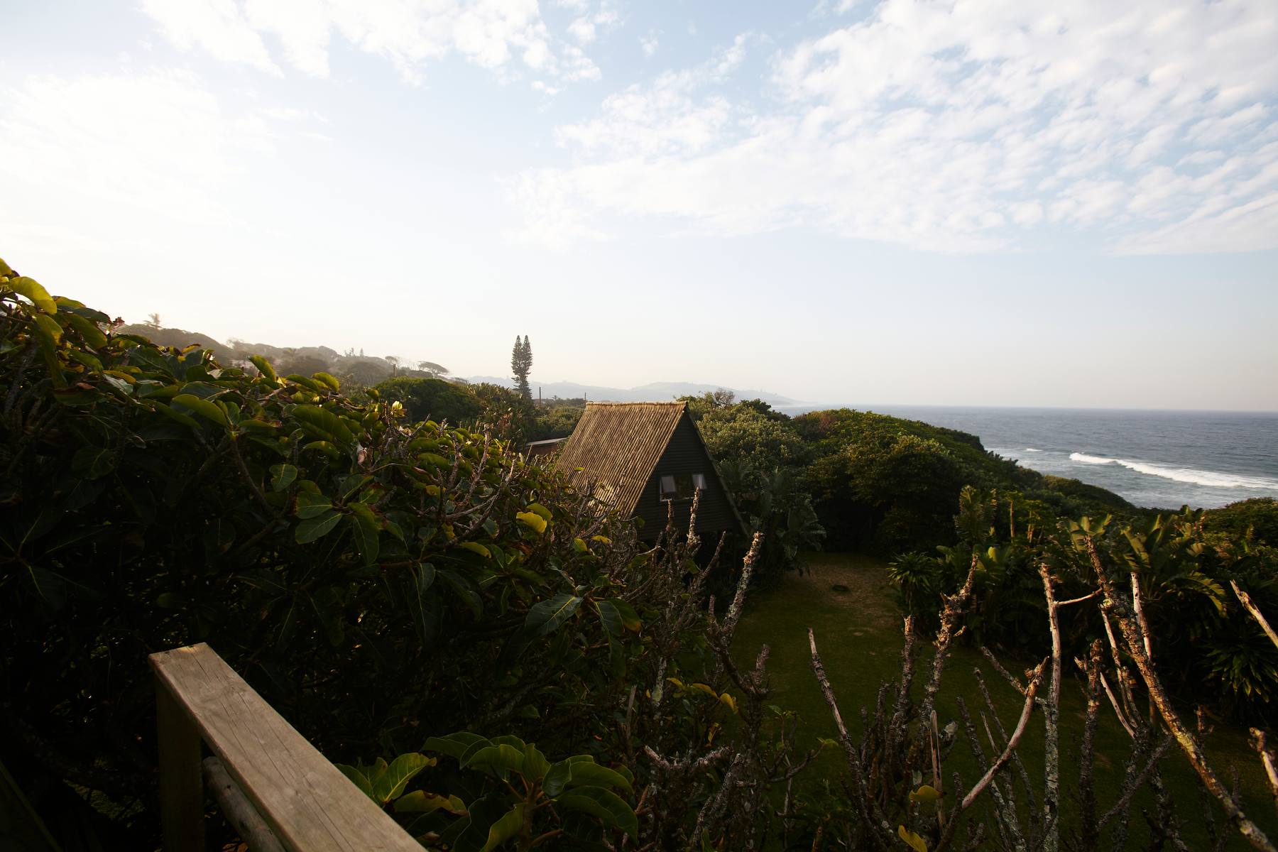 Coastal path view from an A-frame bungalow at Umzumbe Surf Camp