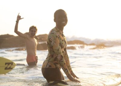 Surfers throwing a shaka on Umzumbe beach