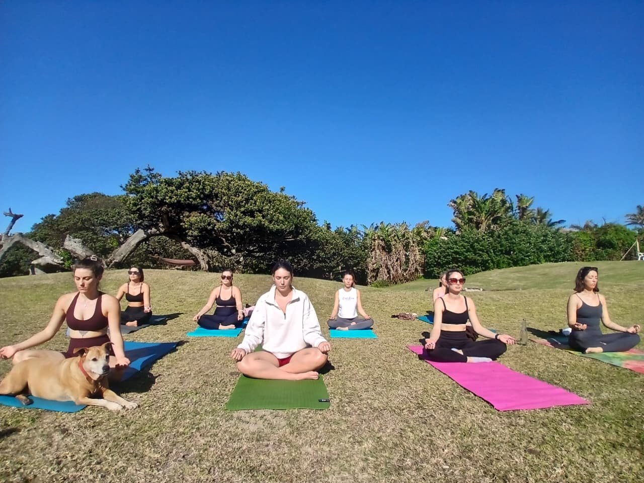 Yoga class on the lawn at Umzumbe Surf Camp